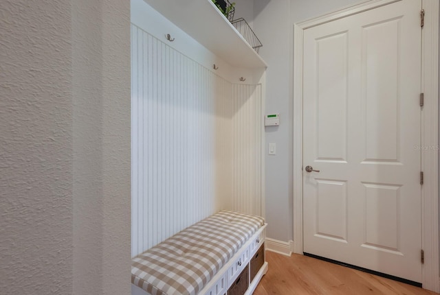 mudroom with light hardwood / wood-style flooring