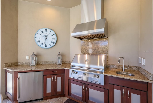 view of patio with an outdoor kitchen, area for grilling, and sink