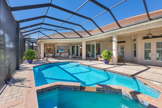 view of pool featuring a lanai, ceiling fan, and a patio