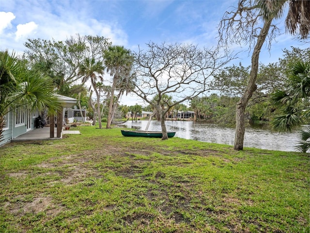 view of yard featuring a patio and a water view