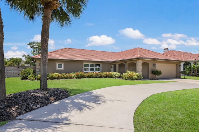 mediterranean / spanish-style house with a front lawn and a garage