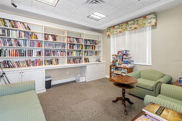 living area featuring carpet