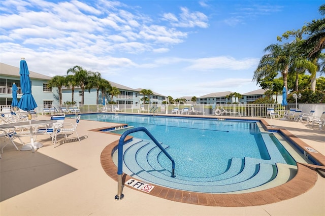 view of swimming pool with a patio