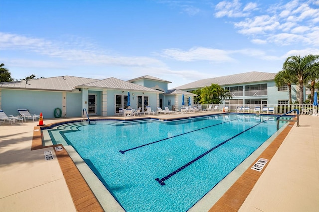 view of swimming pool with a patio area