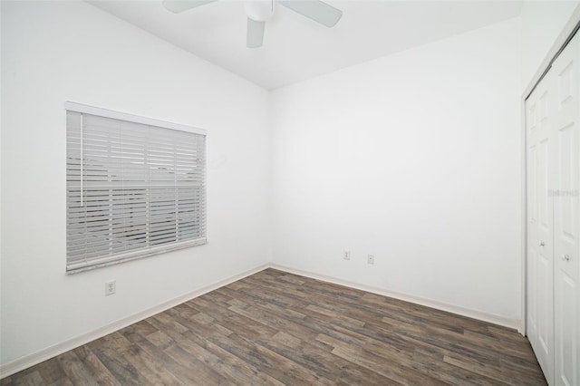 empty room featuring dark hardwood / wood-style floors and ceiling fan