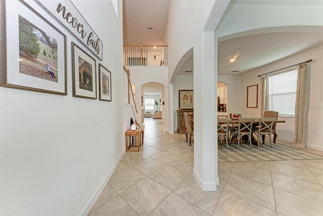 hallway with light tile patterned flooring