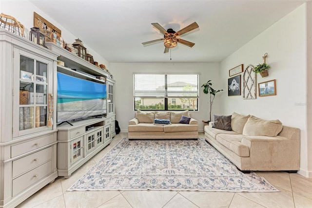 tiled living room with ceiling fan