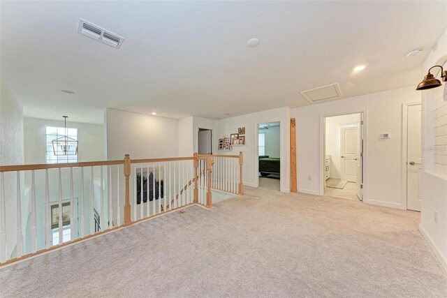 spare room with light colored carpet