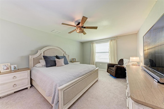 bedroom featuring light carpet and ceiling fan