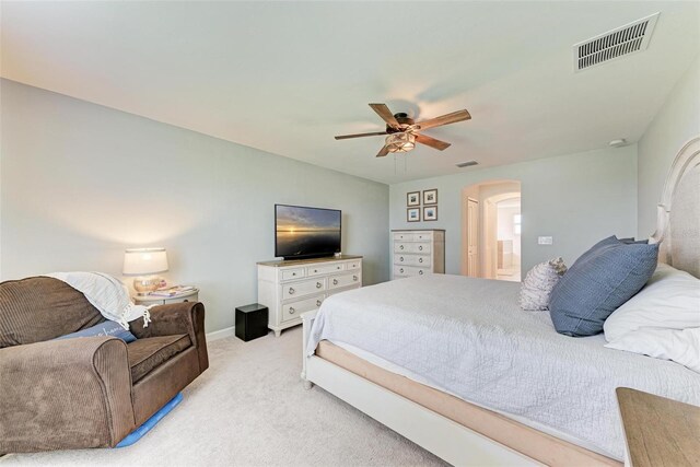 bedroom featuring light colored carpet and ceiling fan