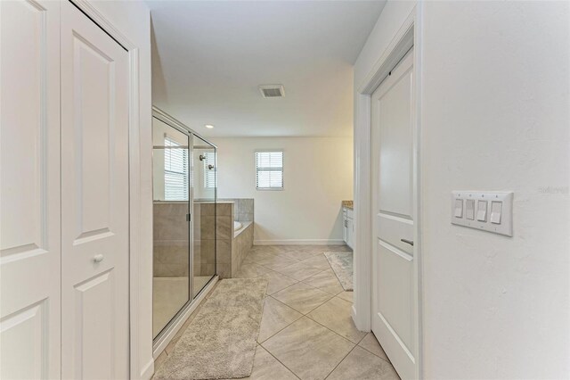 bathroom with separate shower and tub, tile patterned flooring, and vanity