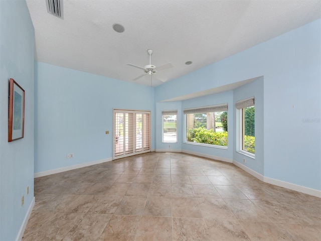 spare room with ceiling fan and lofted ceiling