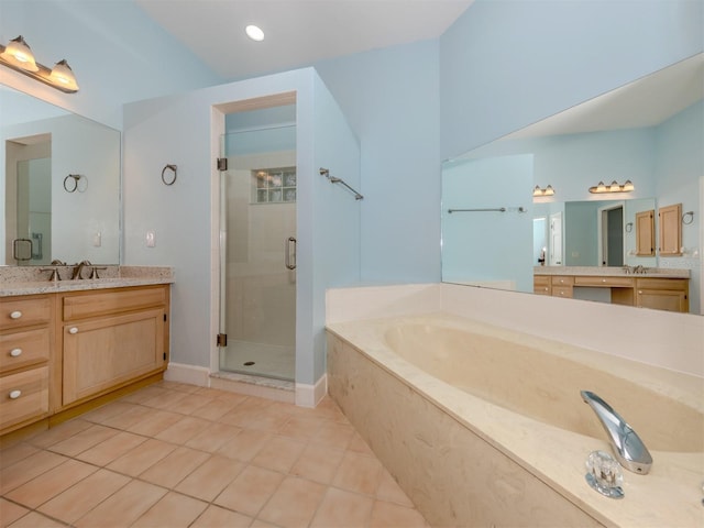 bathroom featuring tile patterned floors, vanity, and independent shower and bath