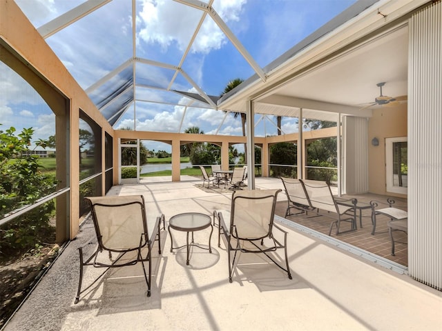 sunroom / solarium featuring ceiling fan and lofted ceiling