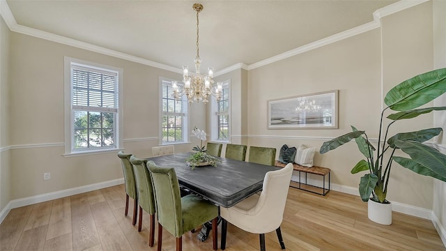 dining area with a notable chandelier, light wood-type flooring, and ornamental molding