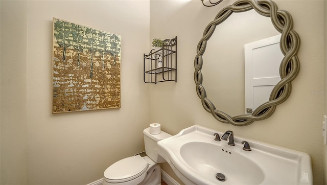 bathroom with sink and toilet