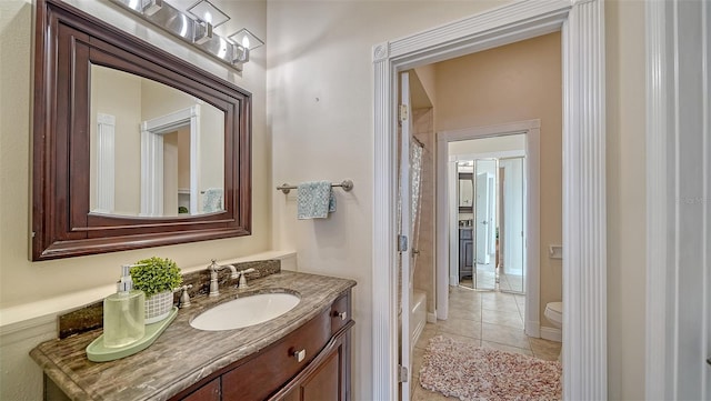 bathroom featuring vanity, toilet, and tile patterned floors