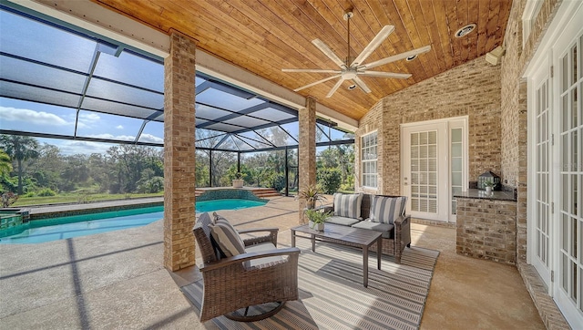 sunroom with lofted ceiling, wooden ceiling, and a swimming pool