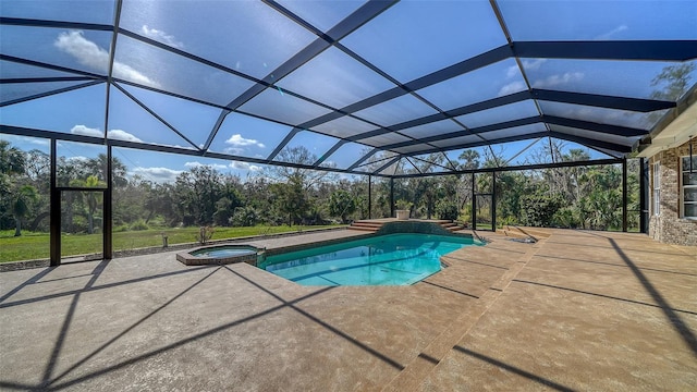 view of pool with a patio area, an in ground hot tub, and a lanai