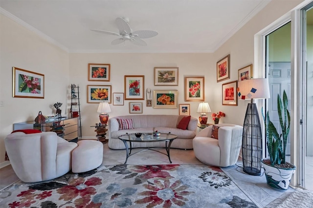 living room with ceiling fan and ornamental molding