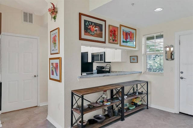 interior space featuring light tile patterned floors