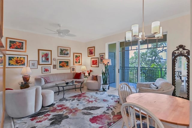 living room with crown molding and ceiling fan with notable chandelier