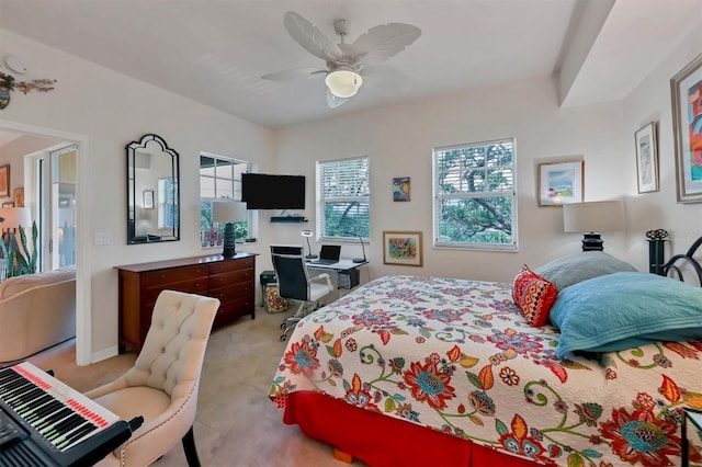 bedroom with ceiling fan and light colored carpet