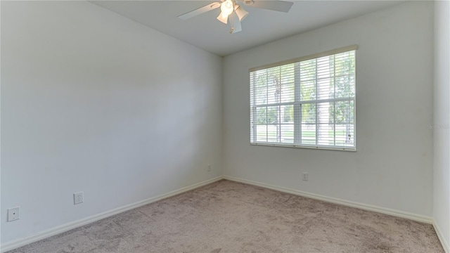 empty room with light carpet and ceiling fan