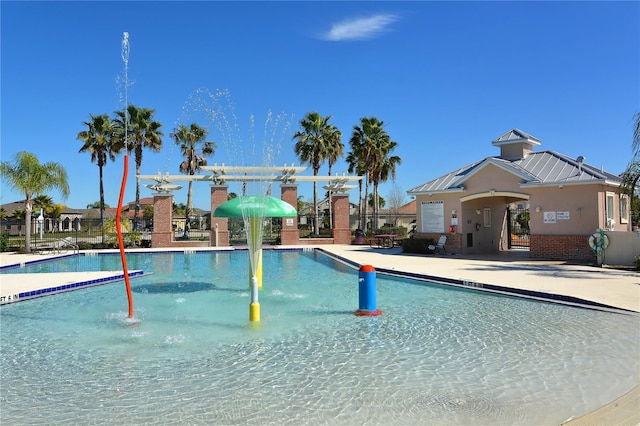 view of swimming pool featuring a patio area and pool water feature