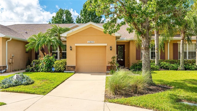 ranch-style house with a garage and a front lawn