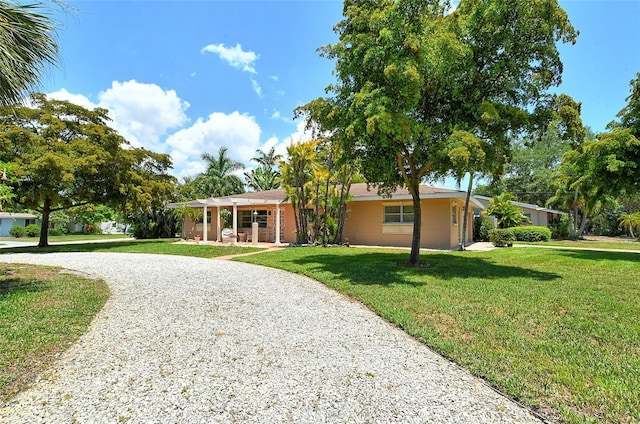 single story home with a front yard