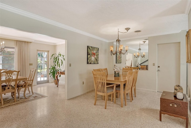 dining room with ornamental molding, a textured ceiling, and an inviting chandelier