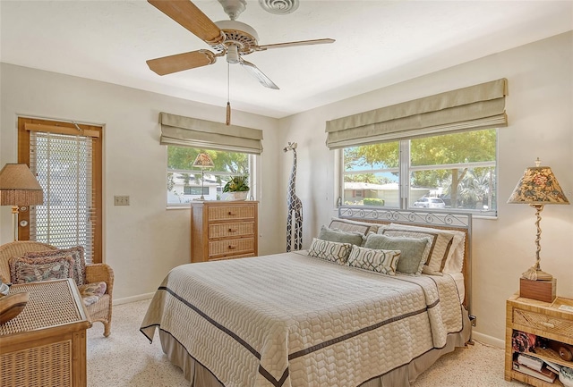 bedroom featuring light colored carpet and ceiling fan