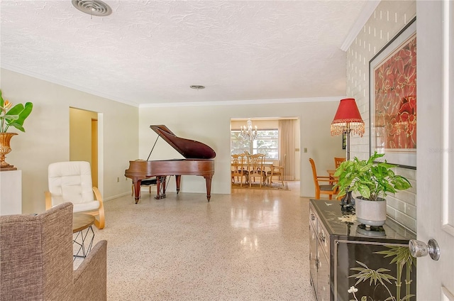 living area with an inviting chandelier, ornamental molding, and a textured ceiling