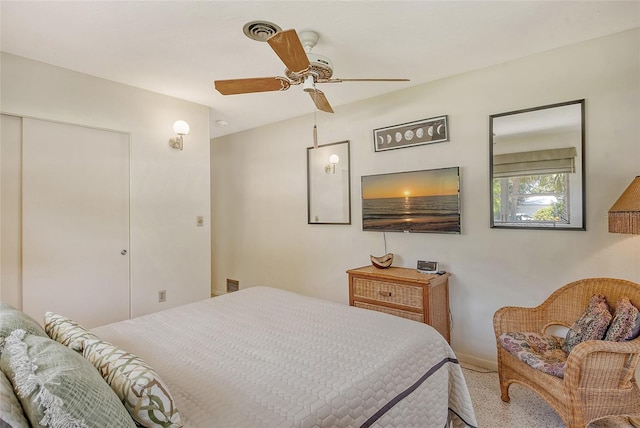 bedroom with ceiling fan and a closet