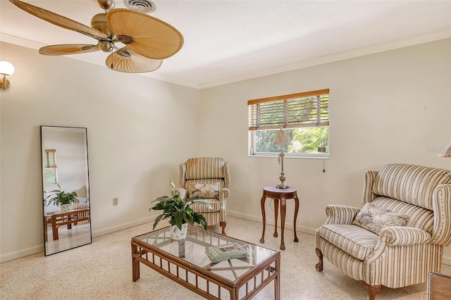 sitting room featuring ceiling fan and ornamental molding