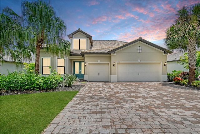 view of front facade with french doors and a garage