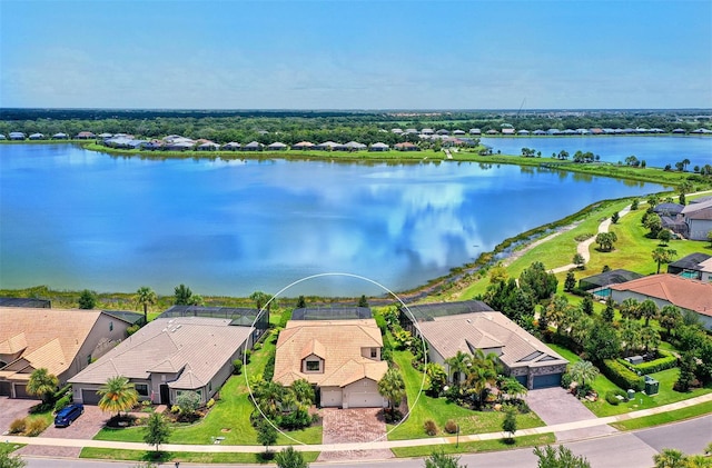 birds eye view of property with a water view