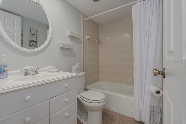 full bathroom with toilet, vanity, shower / bath combo, tile patterned floors, and a textured ceiling