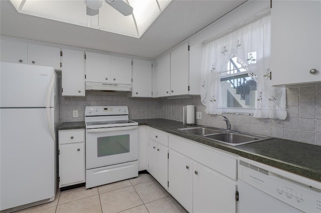 kitchen featuring white cabinetry, sink, white appliances, and light tile patterned floors