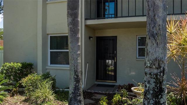 entrance to property with a balcony