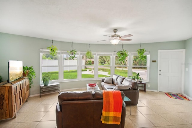 tiled living room featuring ceiling fan