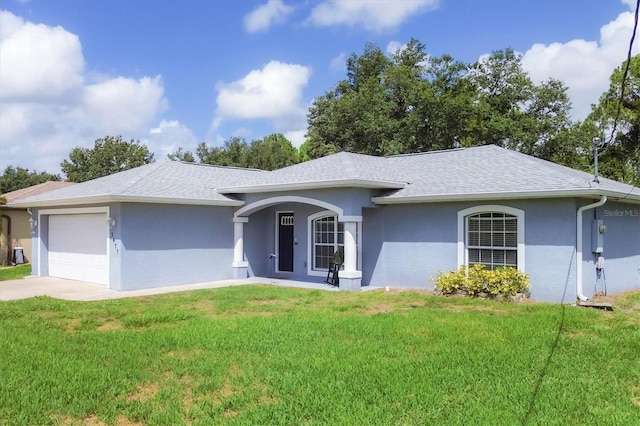 single story home featuring a front lawn and a garage