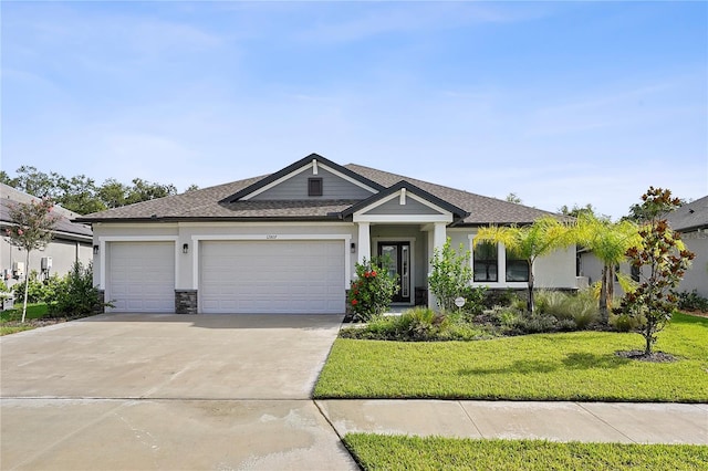 view of front facade with a garage and a front yard