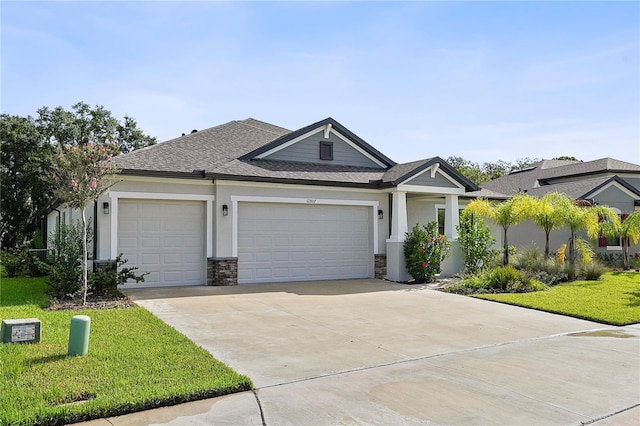 view of front facade featuring a front lawn and a garage