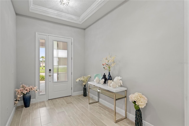 doorway to outside with crown molding, a textured ceiling, and light hardwood / wood-style flooring