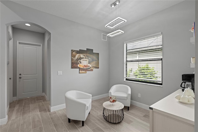 sitting room with light wood-type flooring