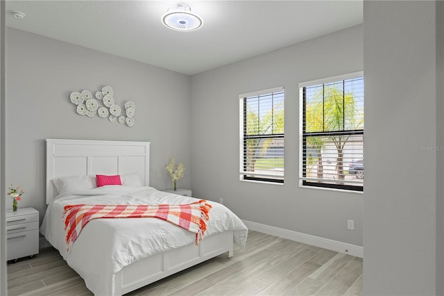 bedroom with light wood-type flooring