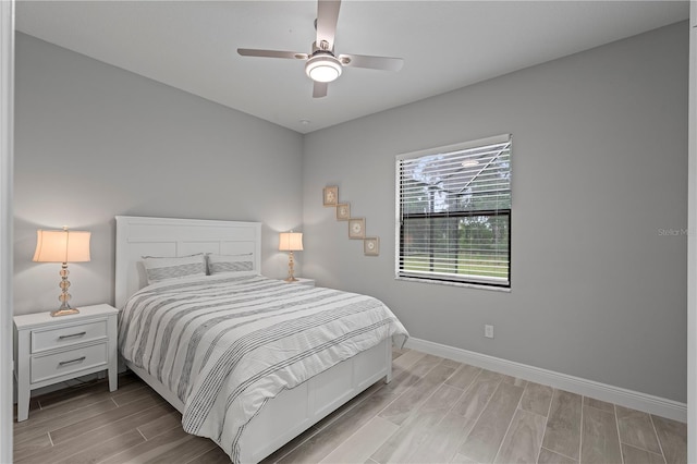 bedroom featuring ceiling fan and light wood-type flooring