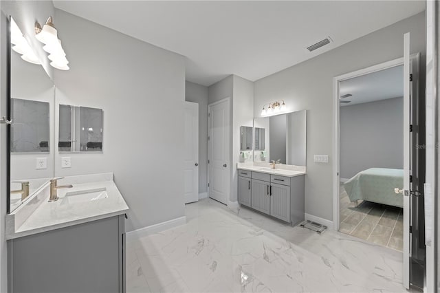 bathroom featuring tile floors and dual bowl vanity